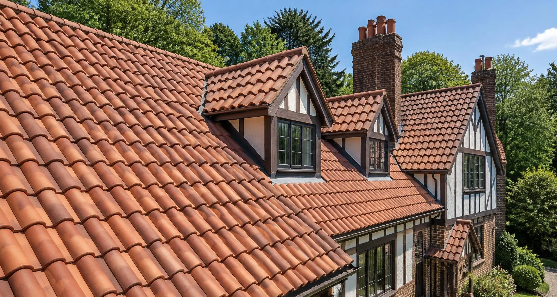 Newly tiled clay roof on a Tudor-style home